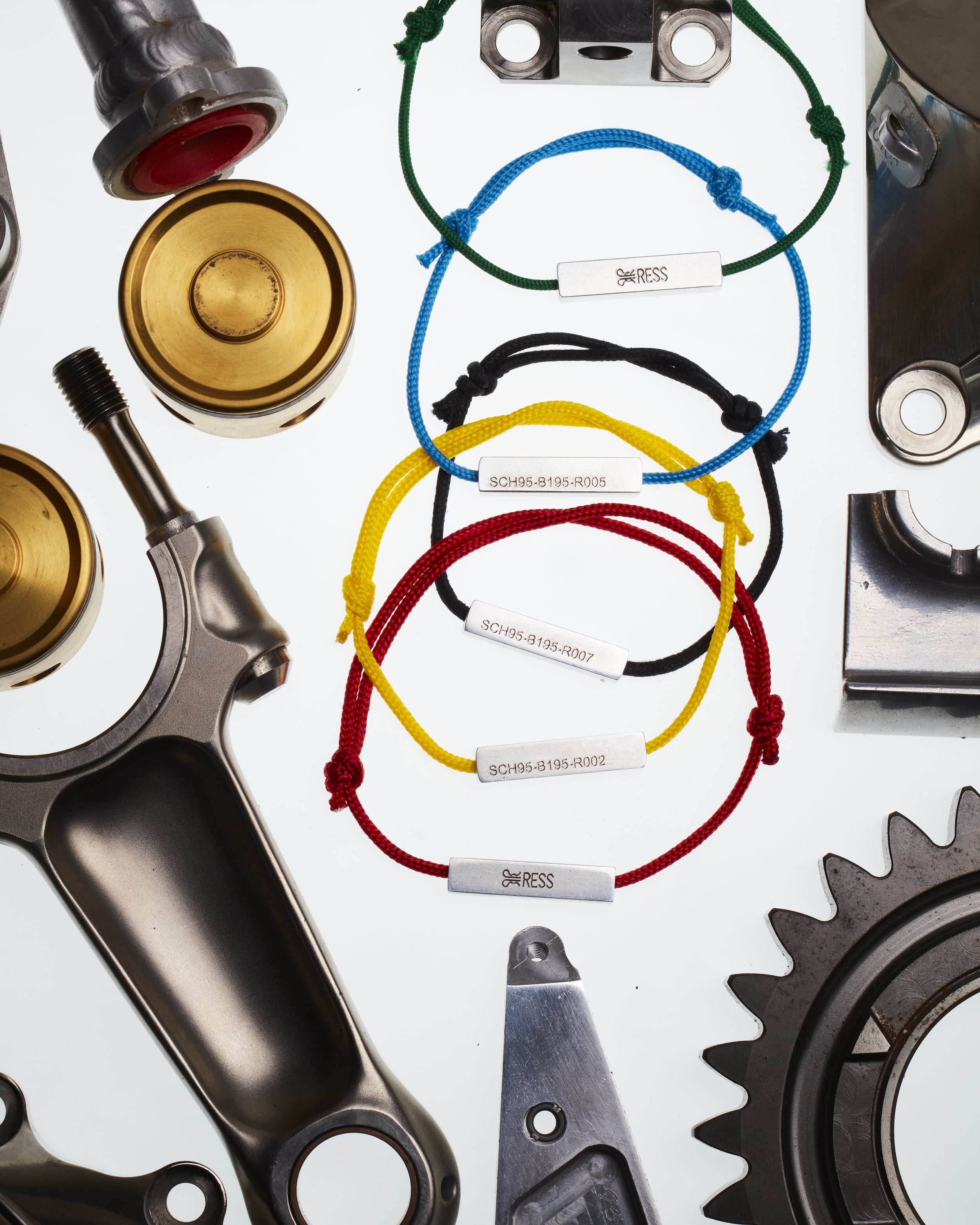 Whole RESS Colours United B195 jewellery bracelet collection. Showing all the bracelet colours available. Bracelet is made from Michael Schumacher's F1 car. The Bracelet is surrounded with real raced F1 parts