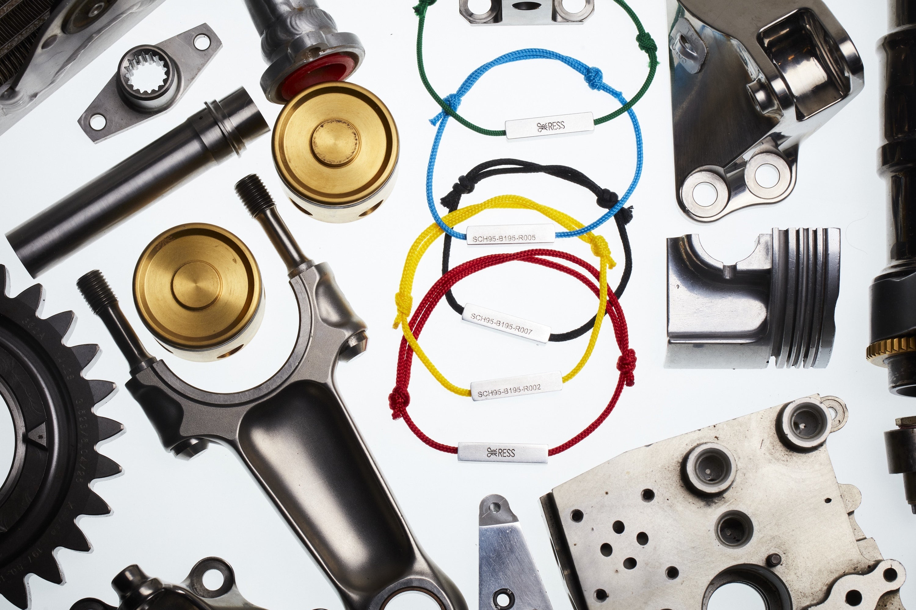 Whole RESS Colours United B195 jewellery bracelet collection. Showing all the bracelet colours available. Bracelet is made from Michael Schumacher's F1 car. The Bracelet is surrounded with real raced F1 parts