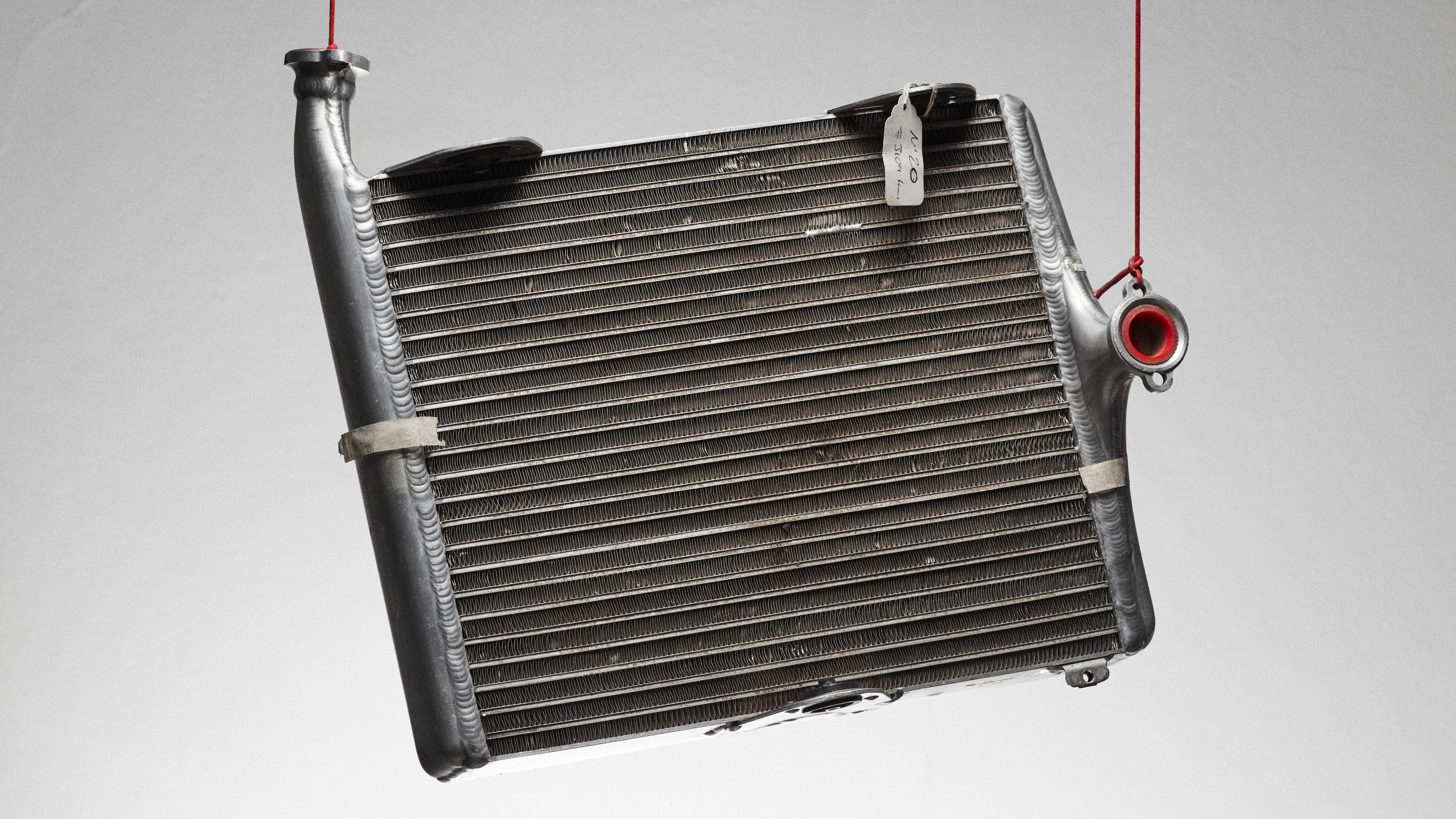 F1 radiator hanging on a red silk cord 