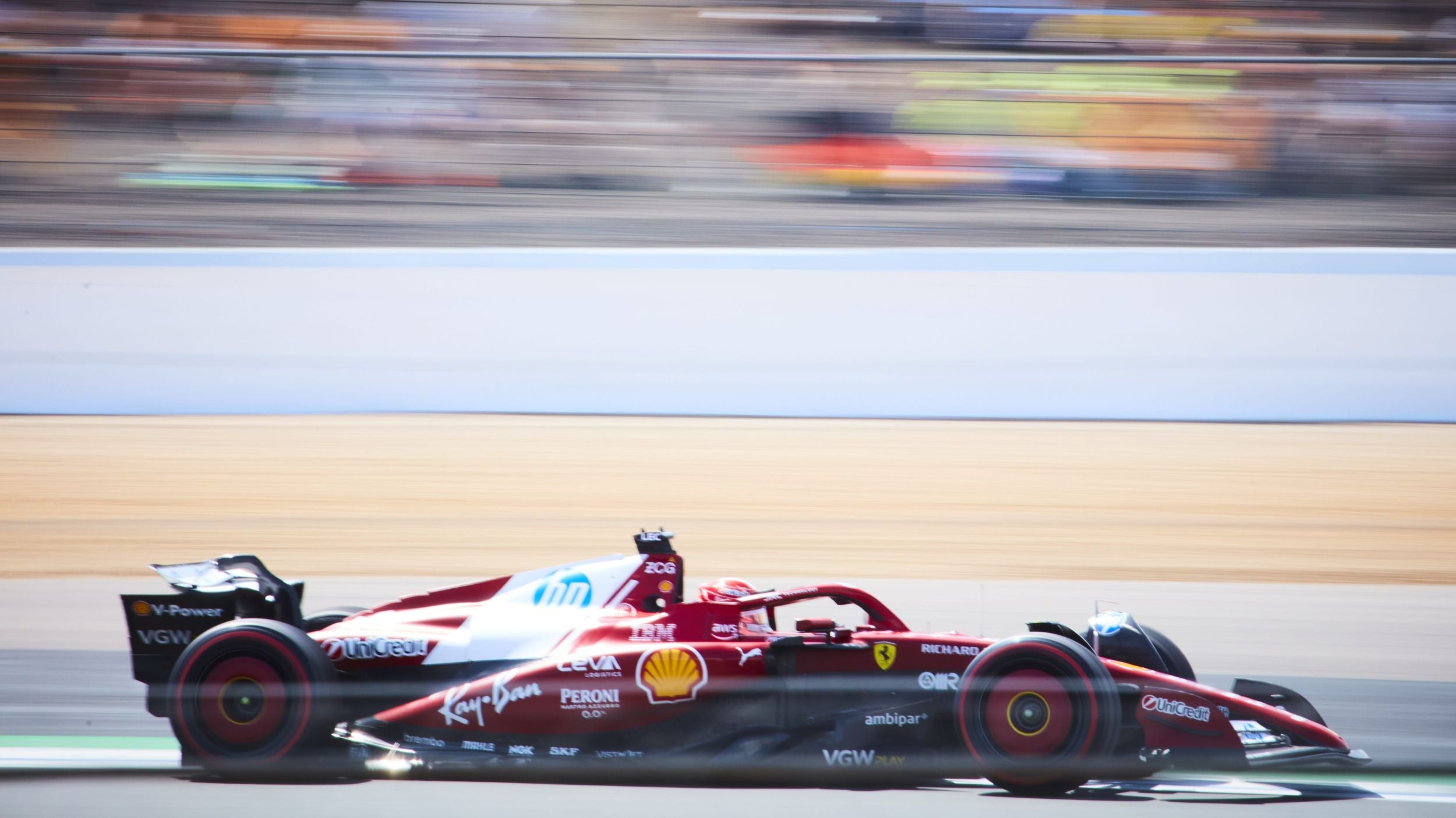 Charlie Leclerc driving his Ferrari F1 car around Silverstone during the British Grand Prix in 2025