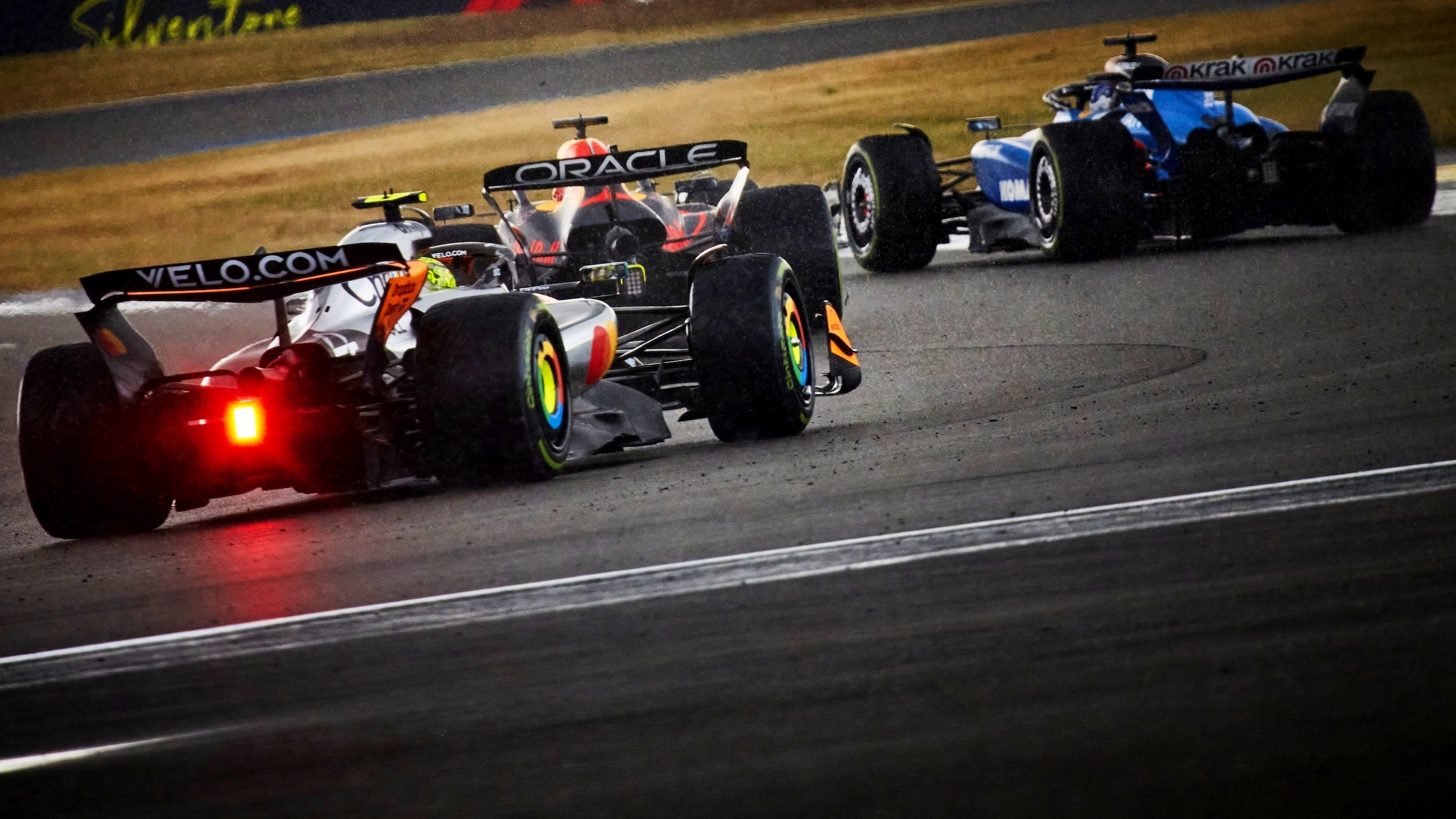 Formula 1 cars racing on a track. McLaren, RedBull Racing and Williams F1 cars on track